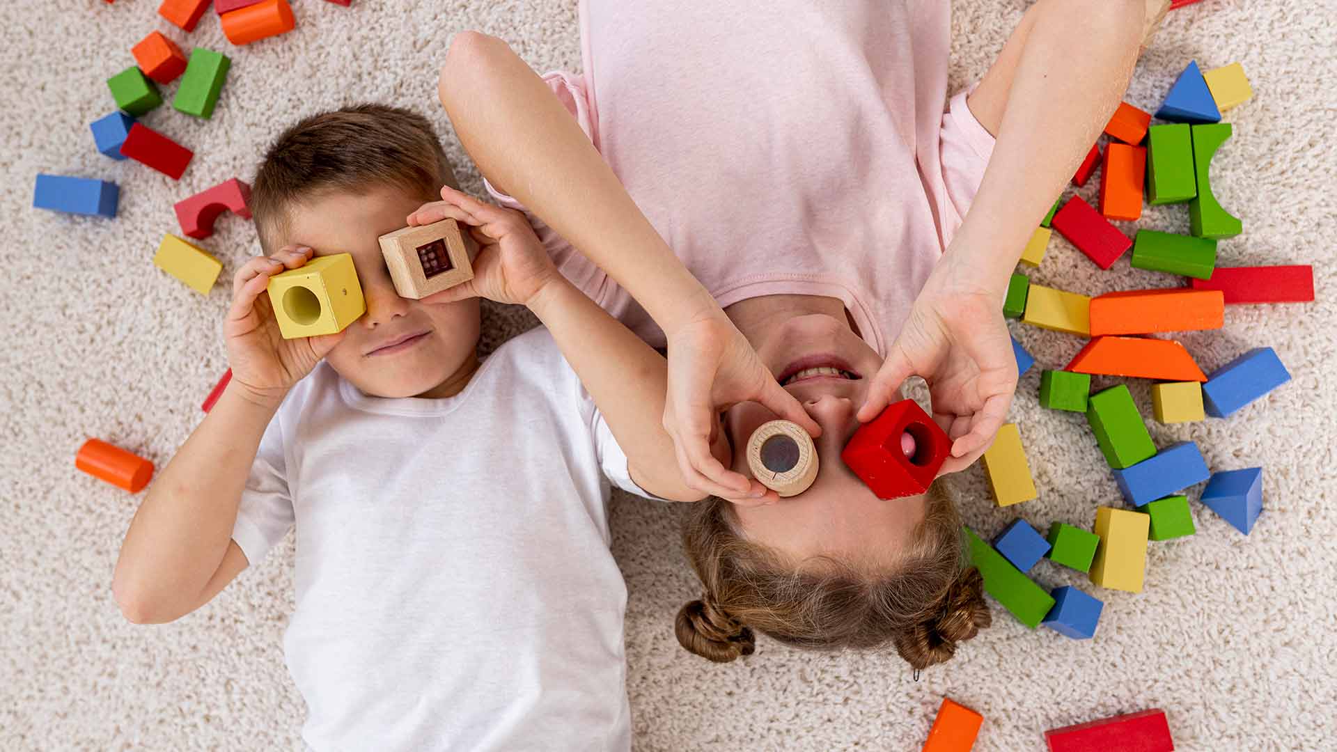 brother and sister playing with blocks