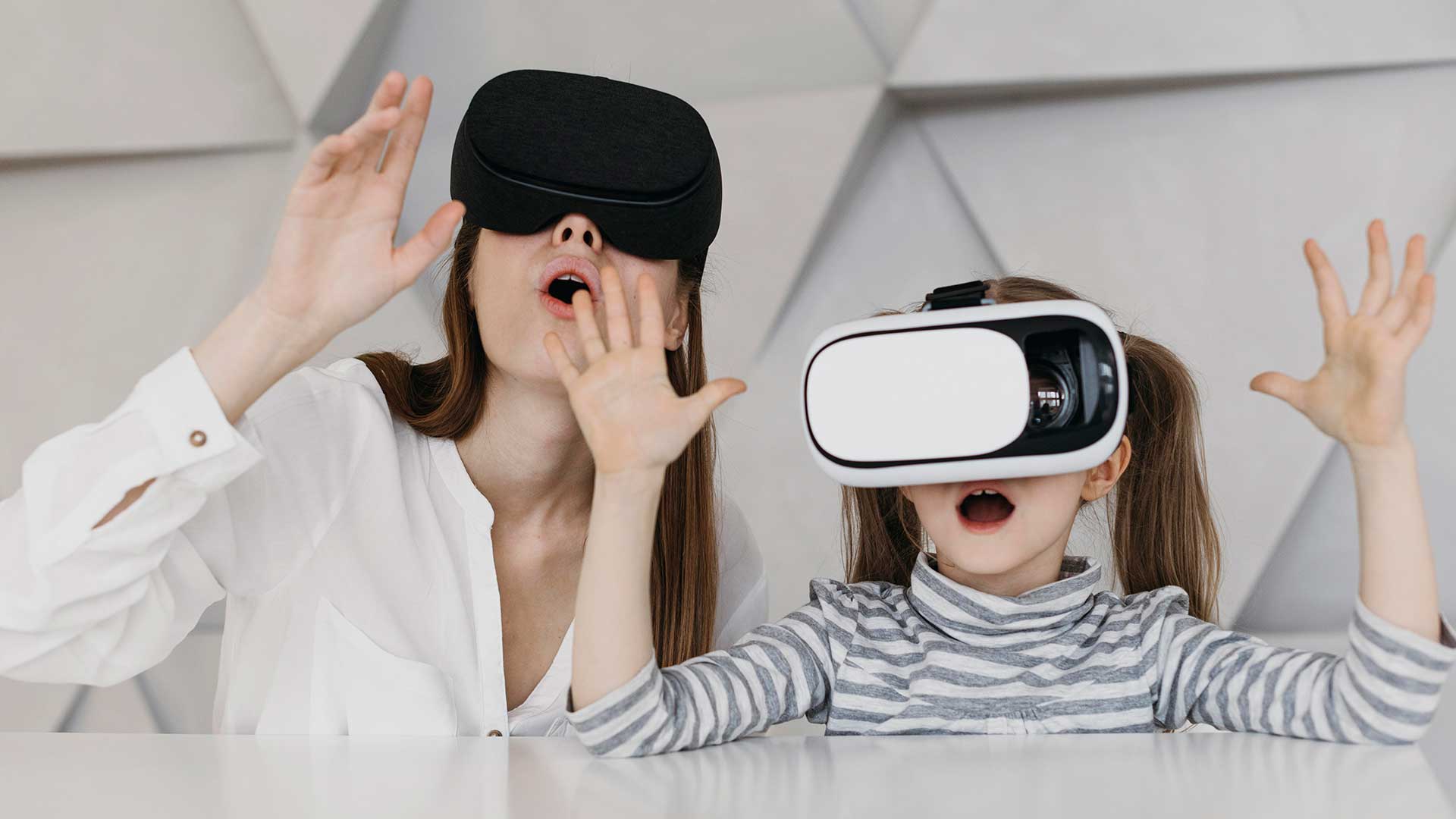 Mother and daughter using VR headsets