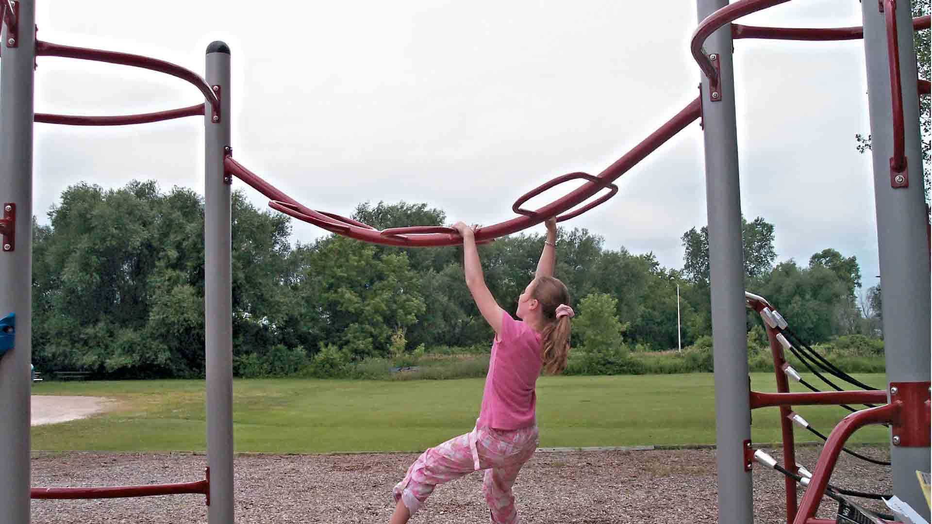 Girl on Monkey Bars