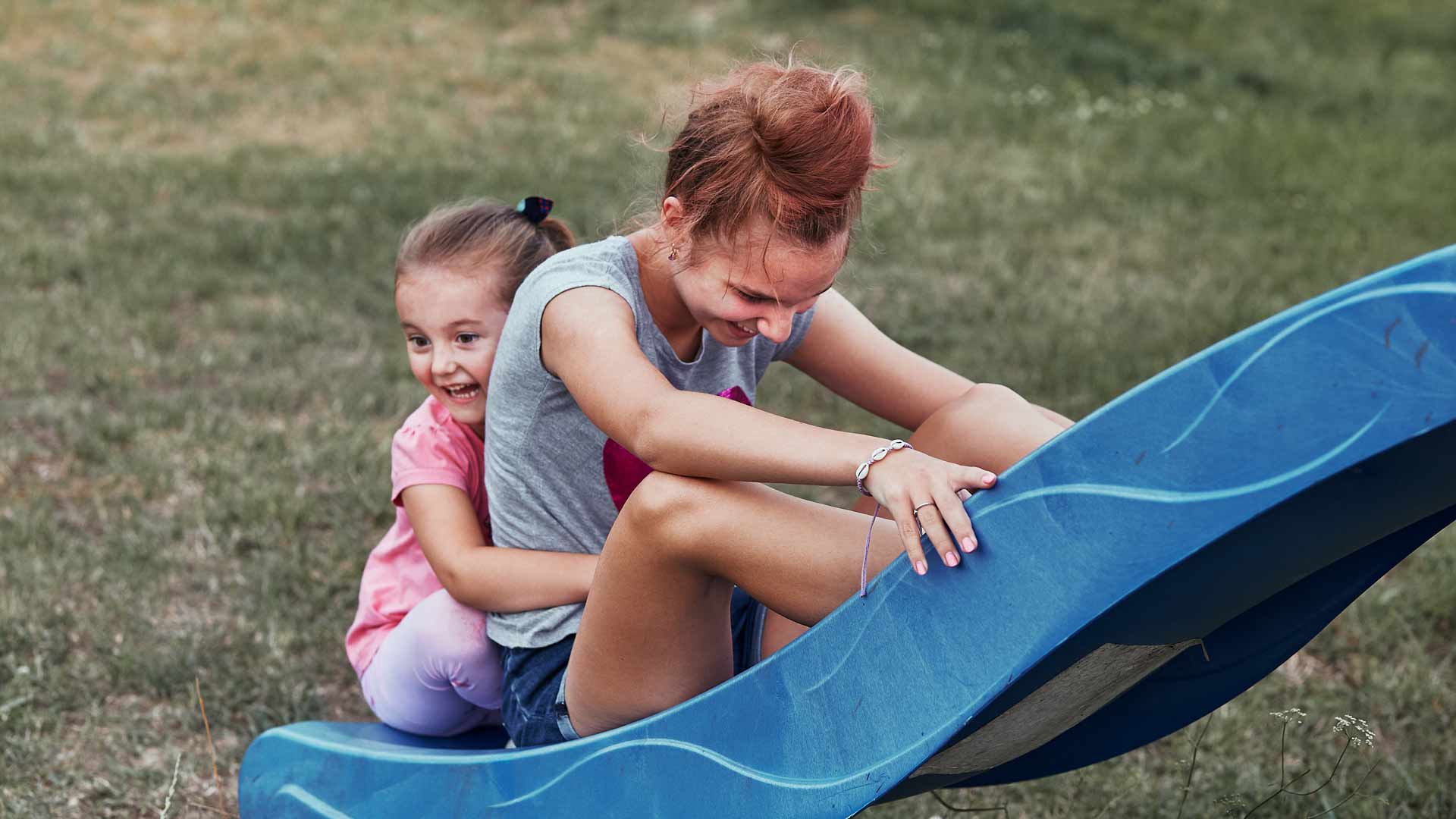 Girls on the slide having fun