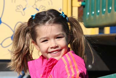 Girl having fun on a playground. Girl having fun on a playground.