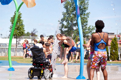 Children of all abilities enjoying a splash pad.