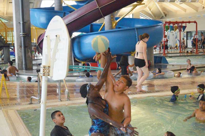 Kids playing water basketball