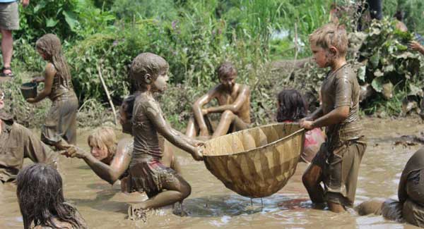 Children playing in the mud Children playing in the mud