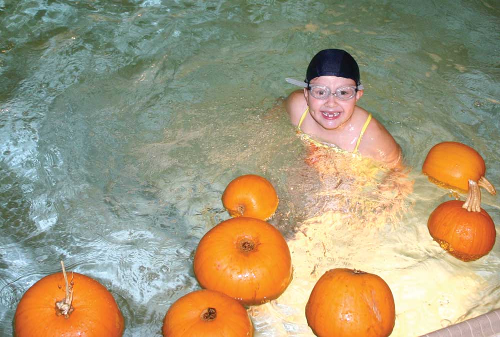 Bobbing for pumpkins in the pool