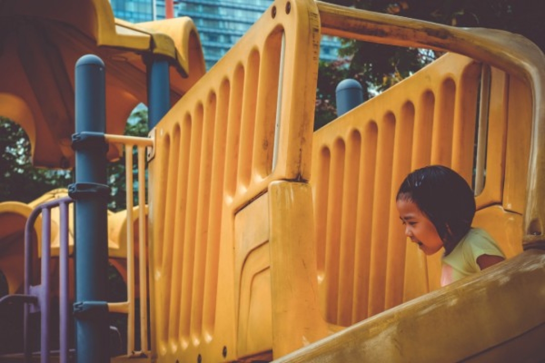 Little girl on a slide