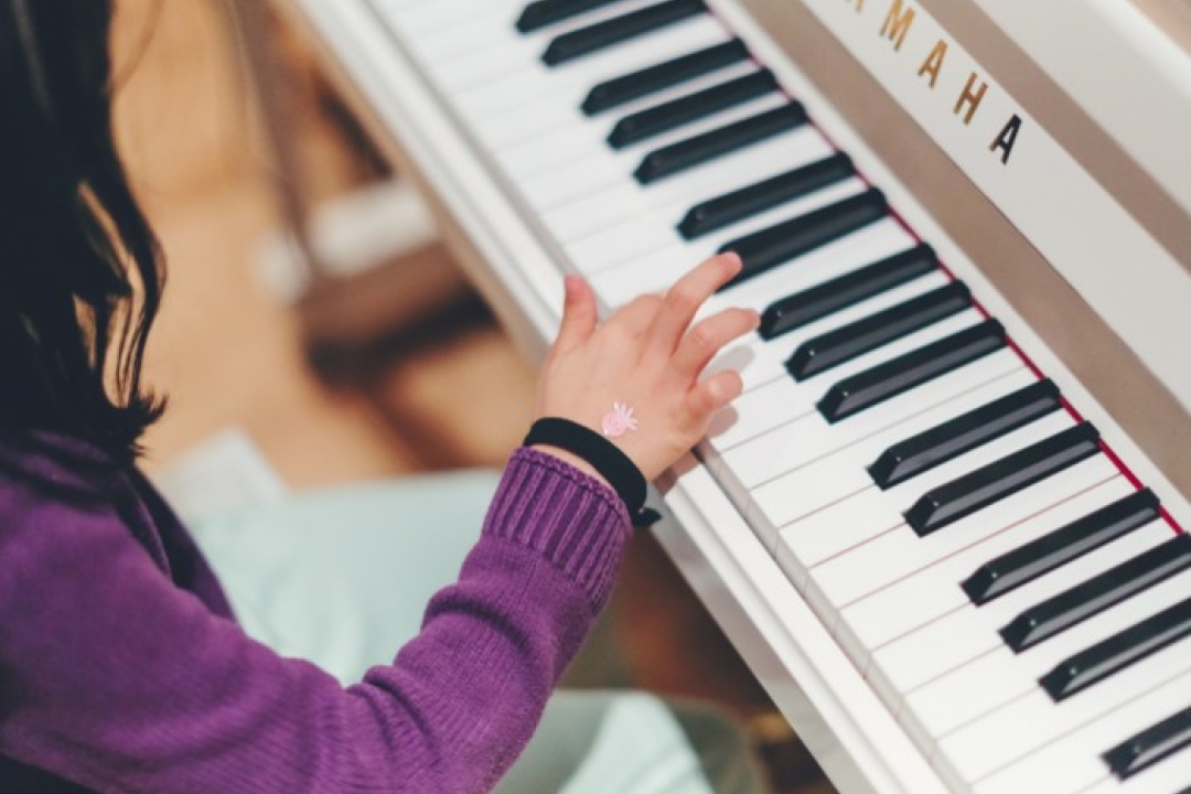 Child playing the piano