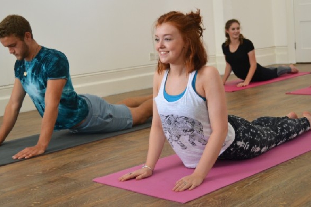 Teens in yoga poses