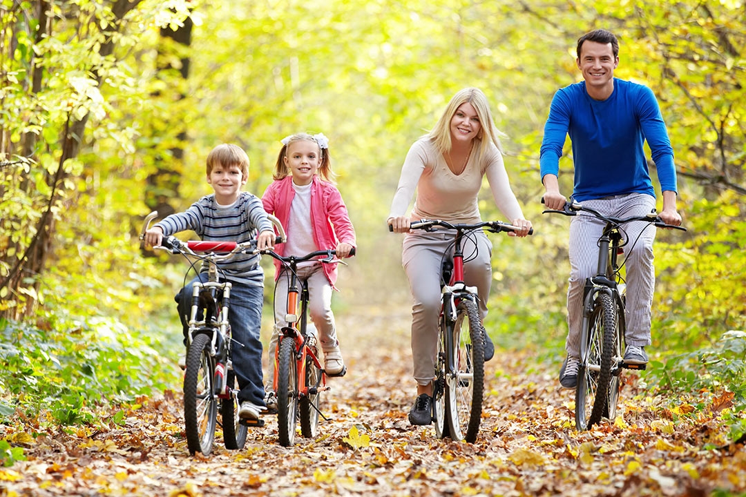 happy family biking on an autumn day