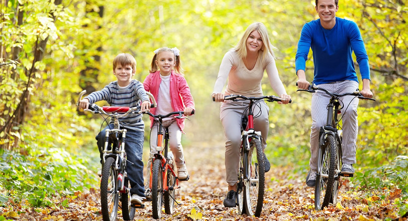 happy family biking on an autumn day