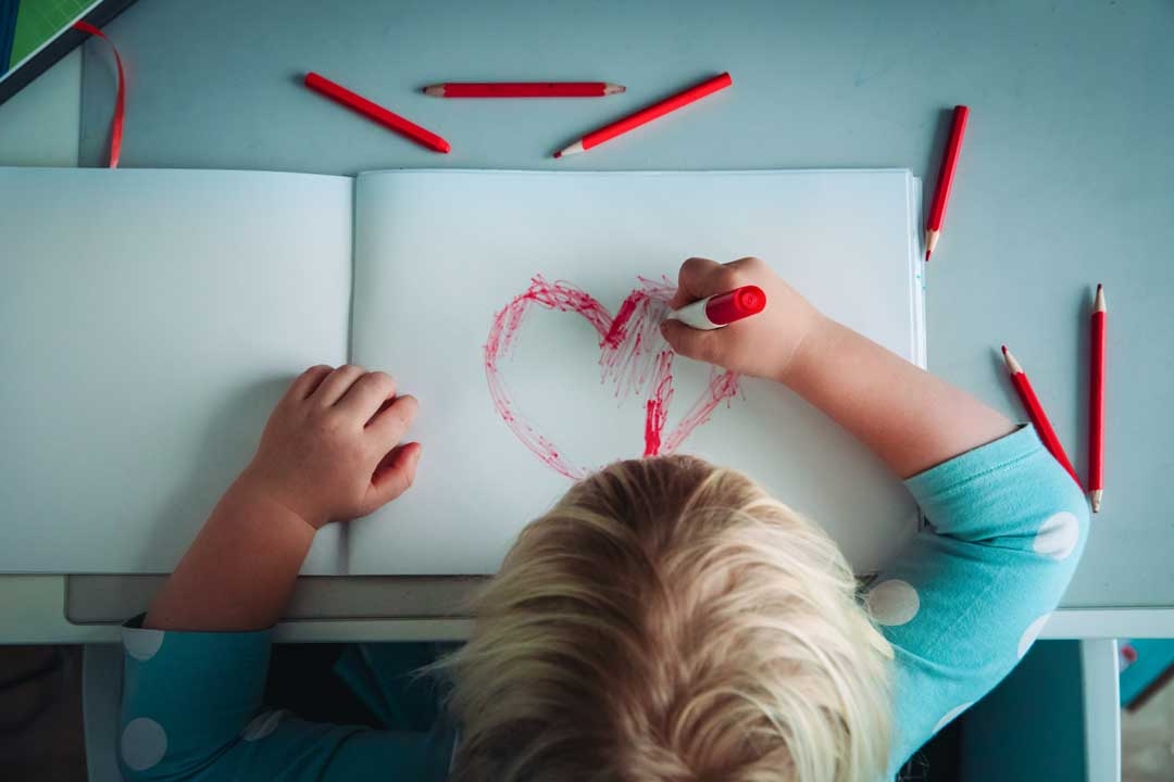 Child painting at school