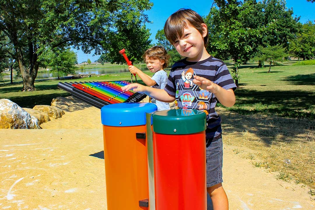 children playing on a musical playground