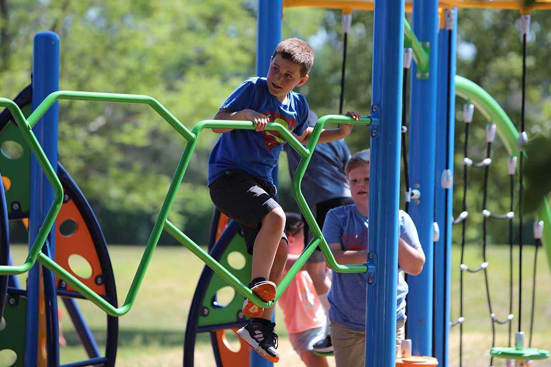 group of boys playing on a playground