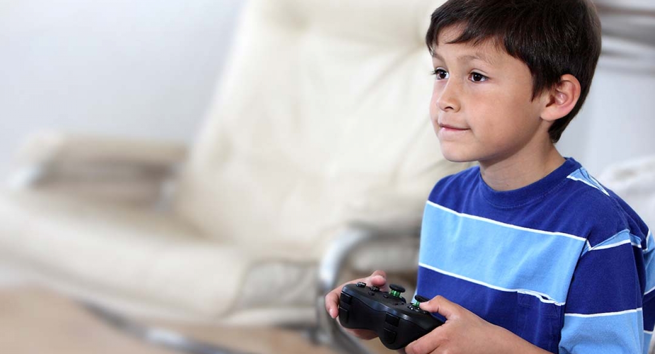 Gamer boy playing video game