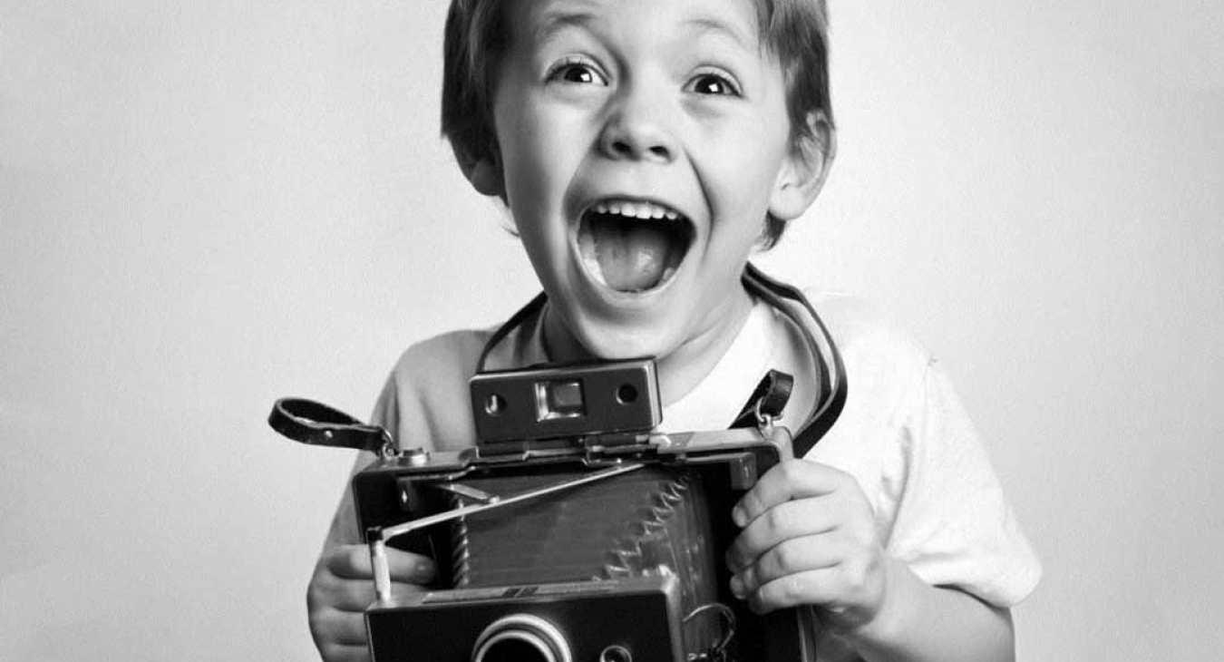 Child with camera taking photos