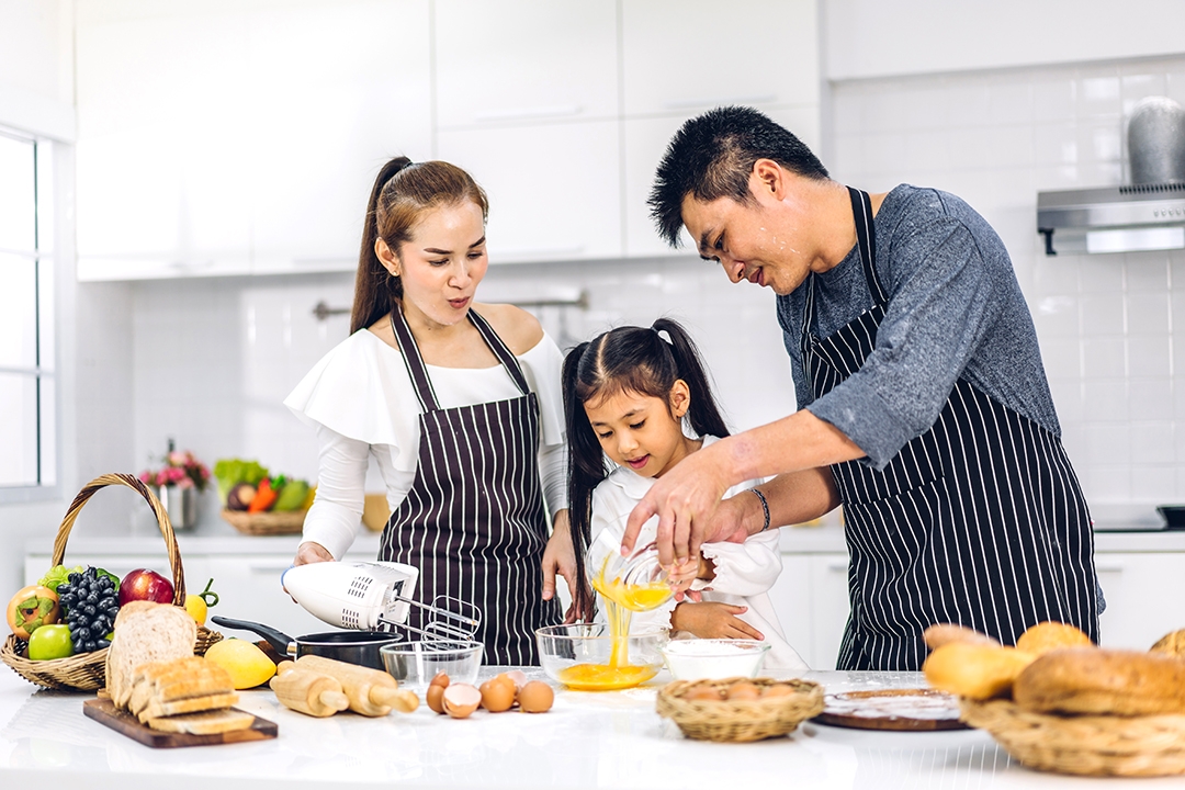 family cooking a meal together