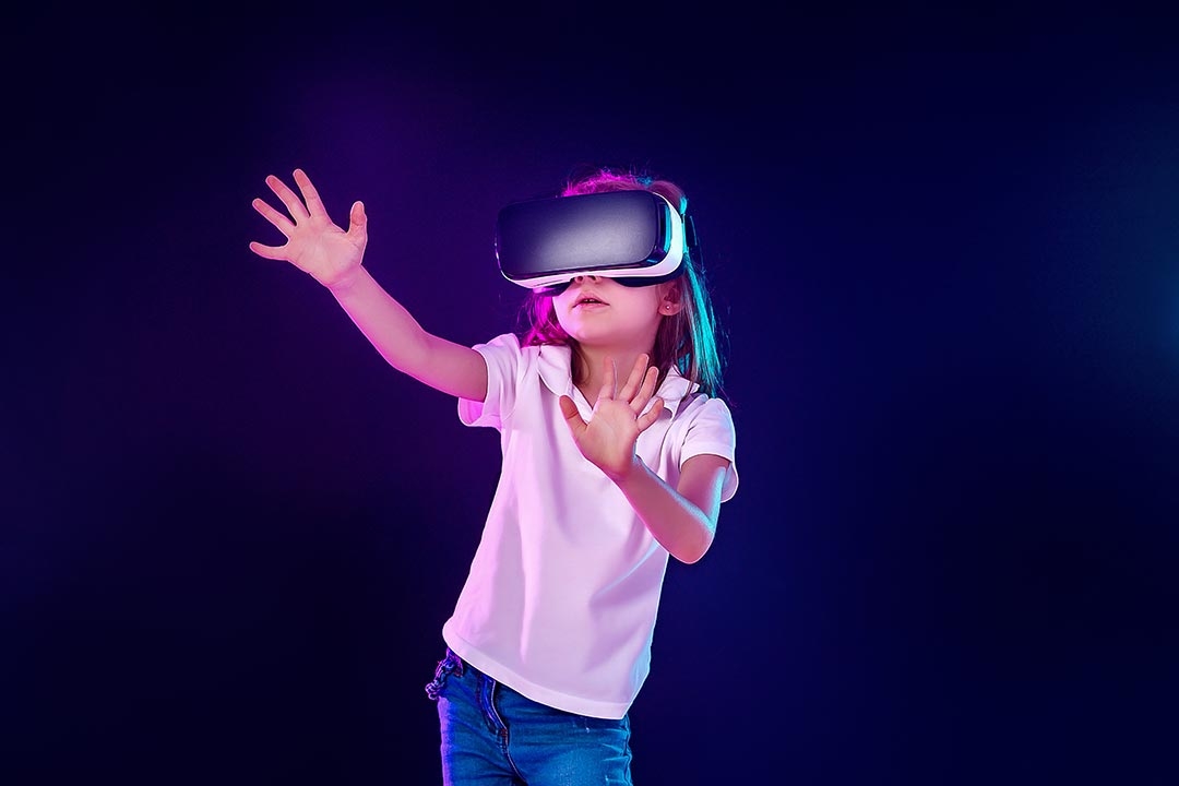 Young girl activley using Virtual Reality