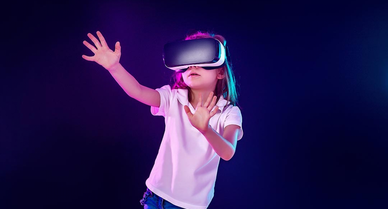 Young girl activley using Virtual Reality