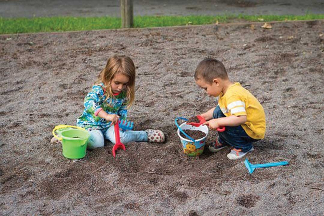 kids playing in a sanitary sand box