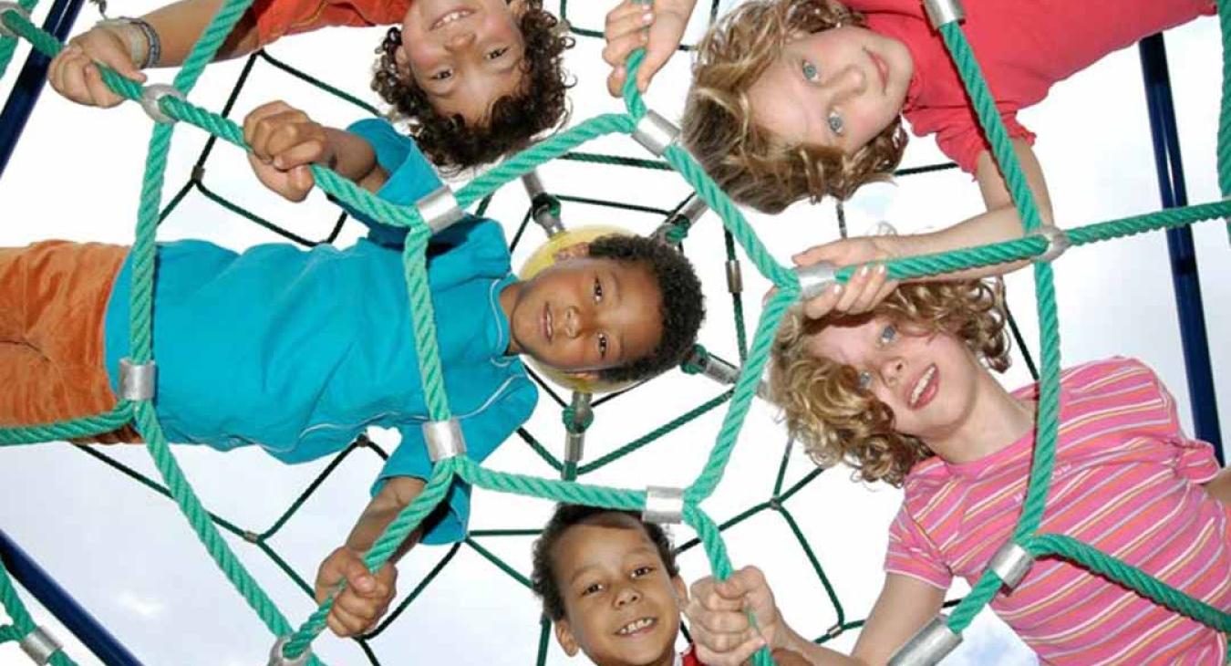 Kids climbing on a rope playground