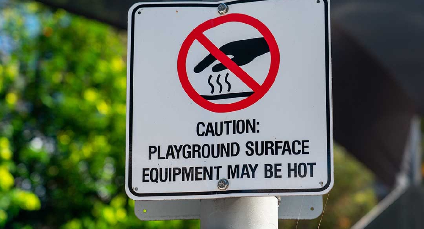 Hot playground surface warning sign