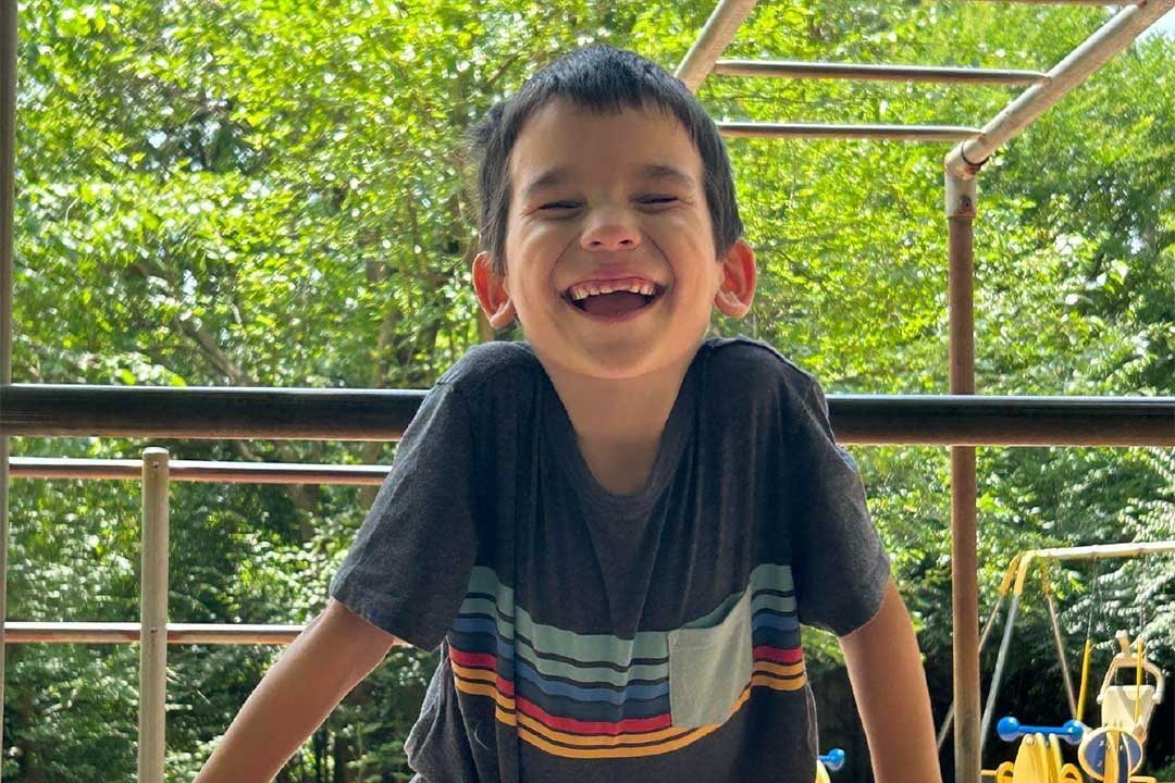 Happy boy playing on playground