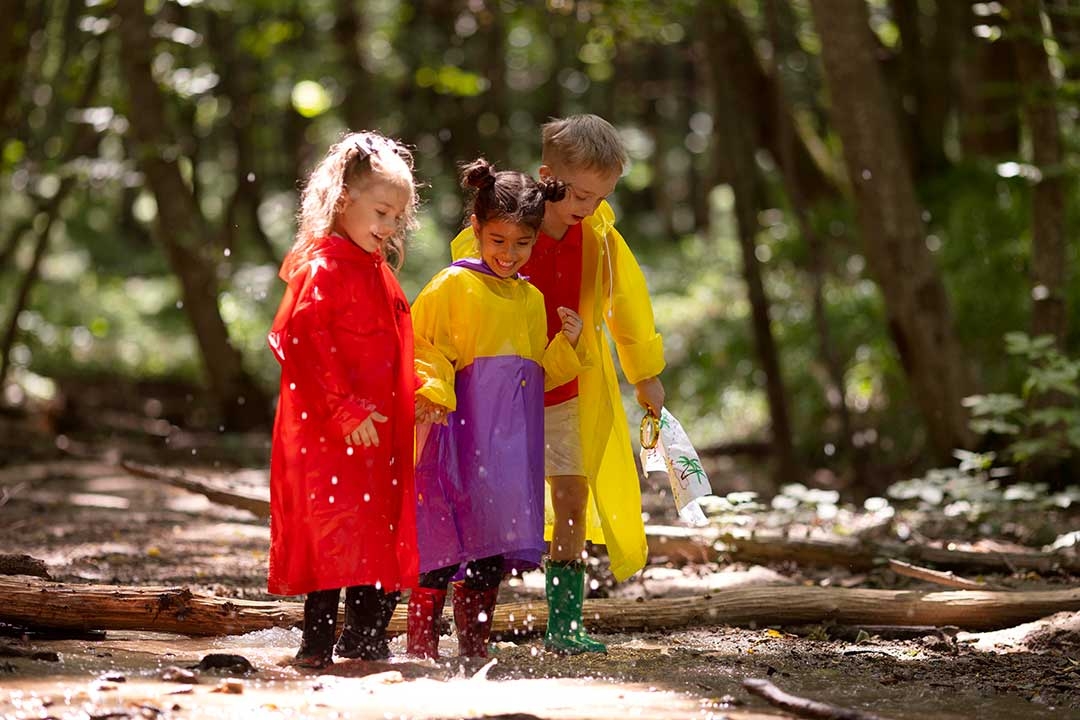 children playing in a puddle