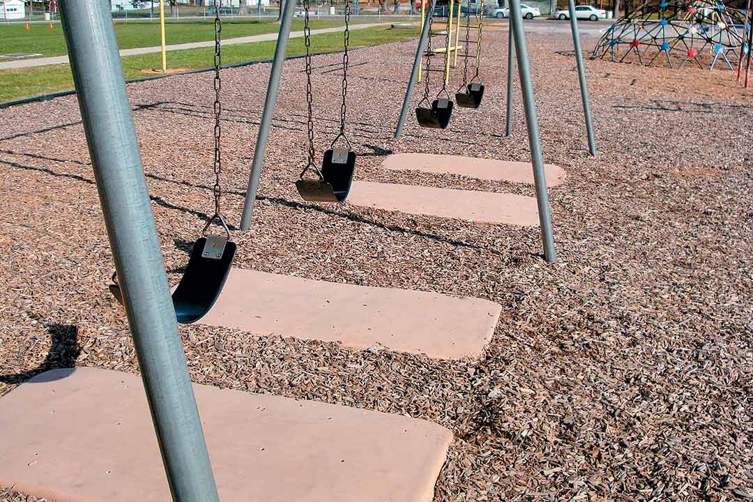 Stomp pads under a swing set