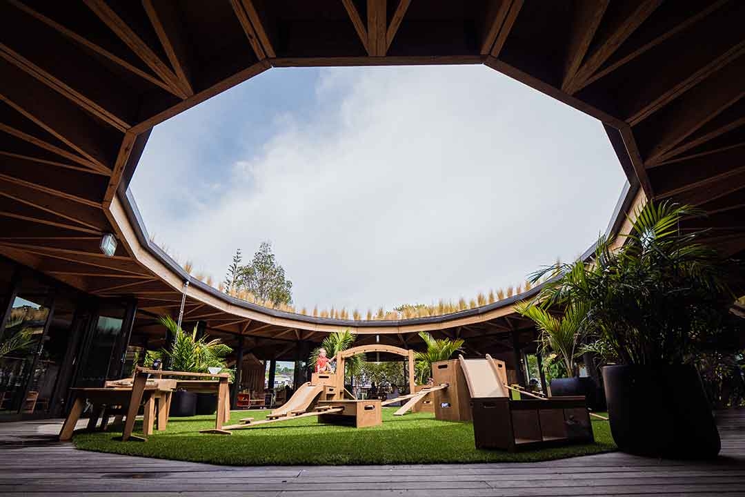 Outdorable moveable timber play equipment installed in a stunning circular open-air pavilion early childhood education setting