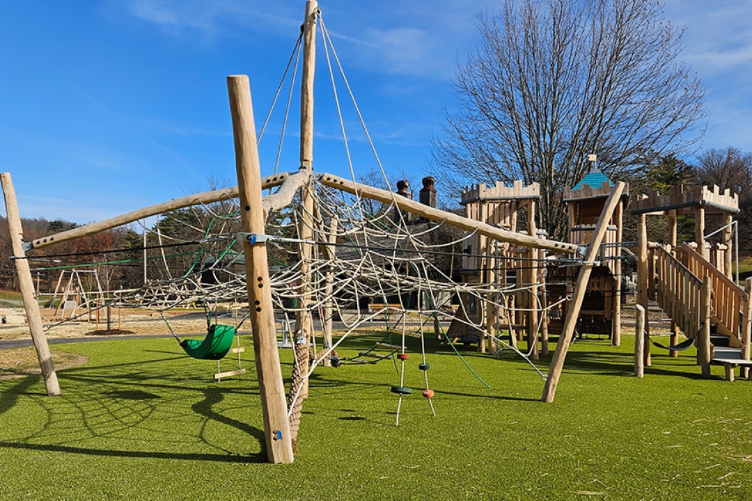 9:48 AMA stunning natural timber playground at South Park in South Park, PA, featuring an expansive rope climbing net, nest swing, balance discs, and a castle-inspired wooden structure — all set on vibrant artificial turf beneath a bright blue sky. This beautiful Allegheny County installation is a testament to YOCCA Playgrounds + Outdoor Fitness's commitment to creating imaginative, inclusive, and engaging outdoor play environments across Western Pennsylvania.