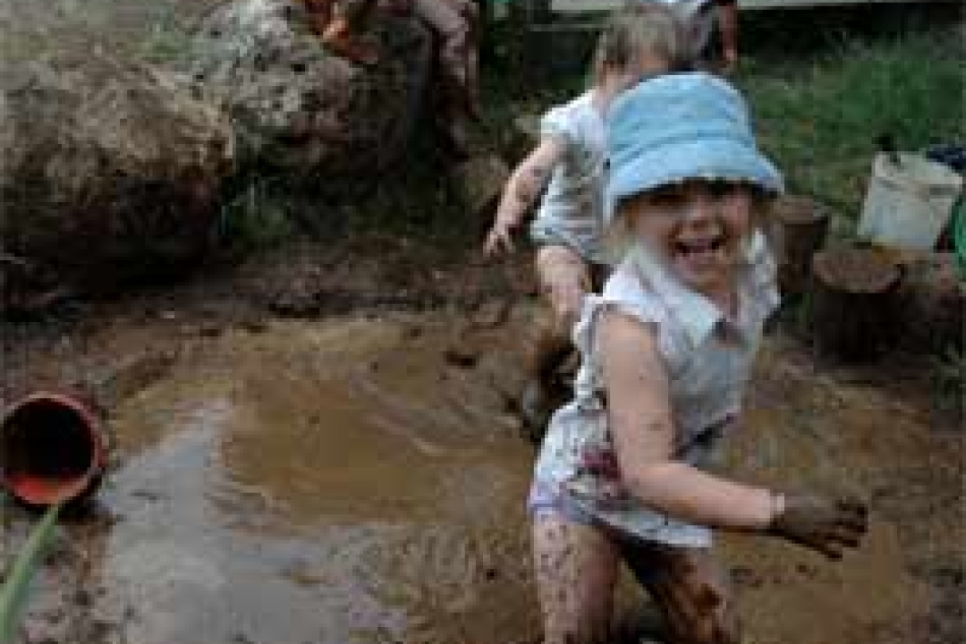 Playing in the mud at Open Spaces Preschool in Whangarei, New Zealand