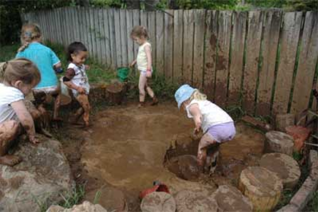 Having fun in the mud - Open Spaces Preschool in Whangarei, New Zealand