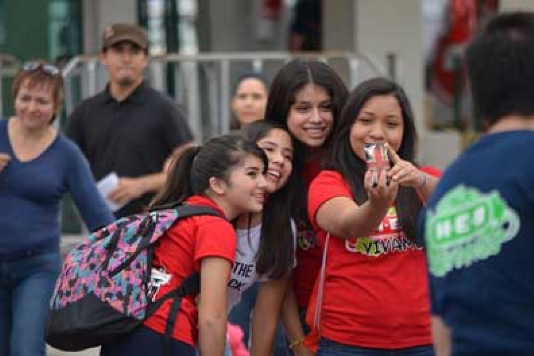 school kids taking selfies