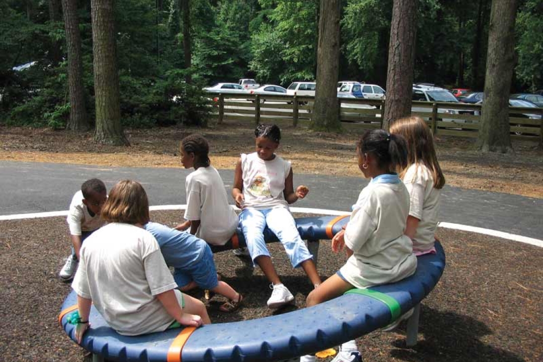 children playing on play equipment