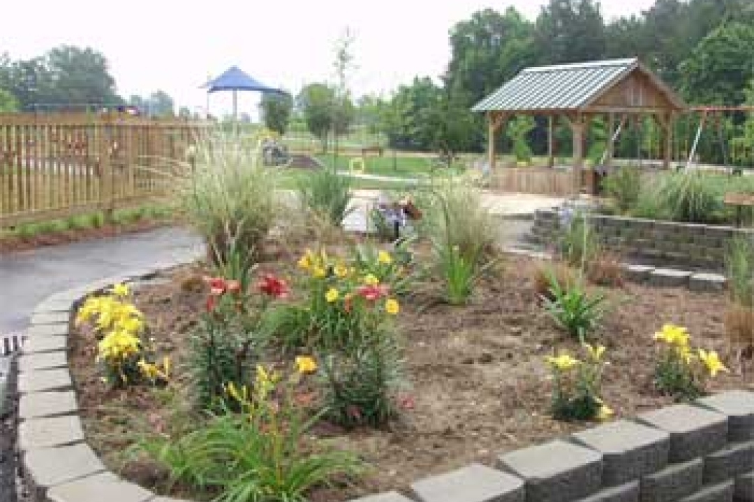 A flower bed in a playground.