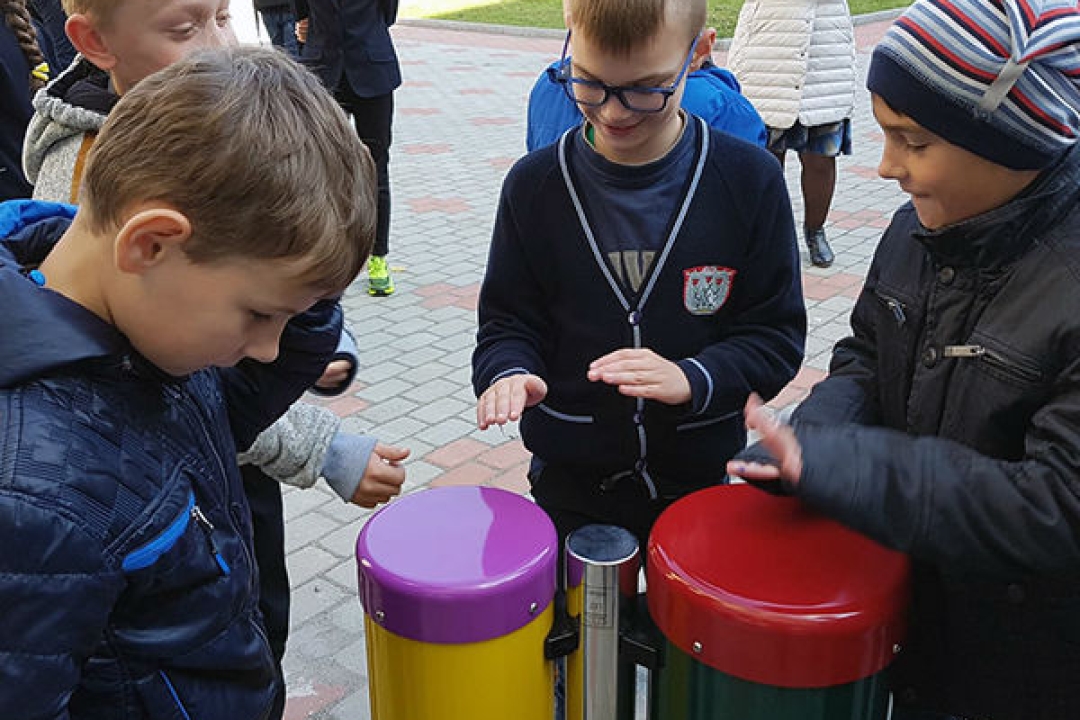 Boys playing conga drums