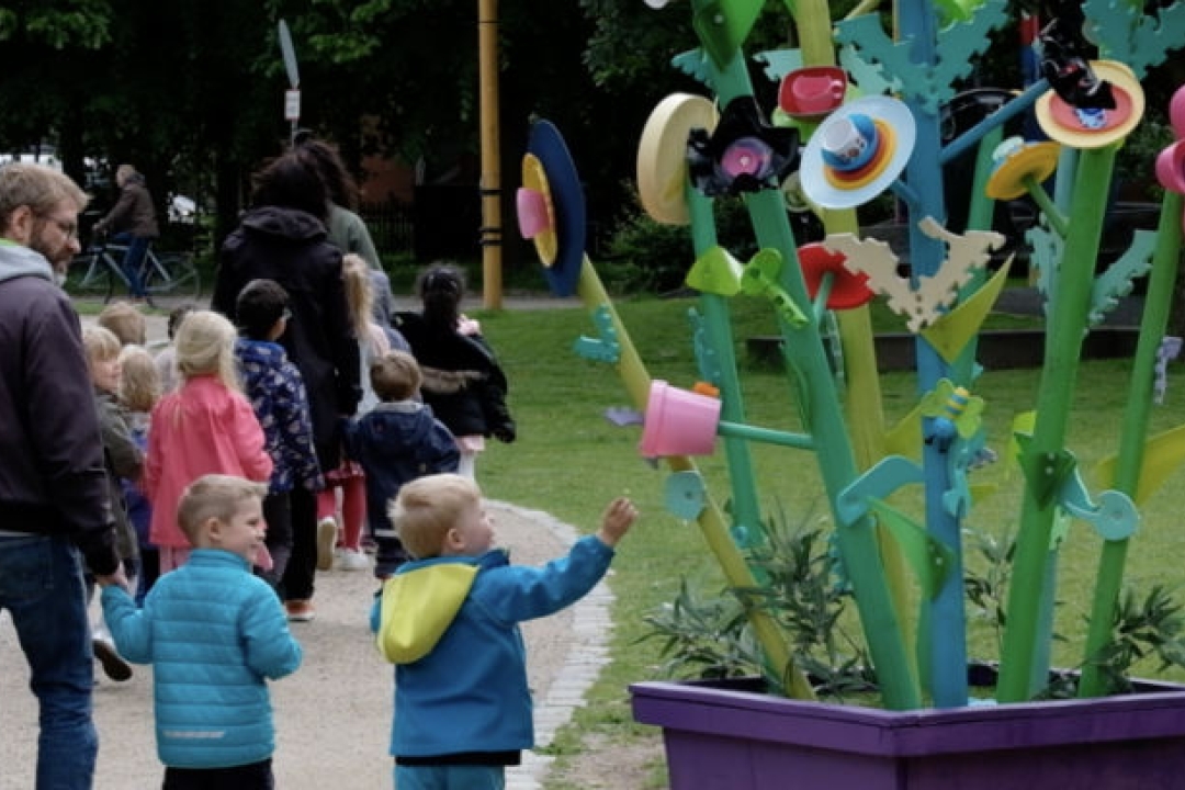 Families walking through Folkets park.