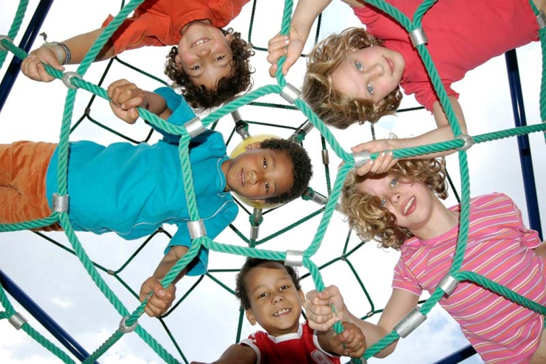 Kids climbing on a rope playground