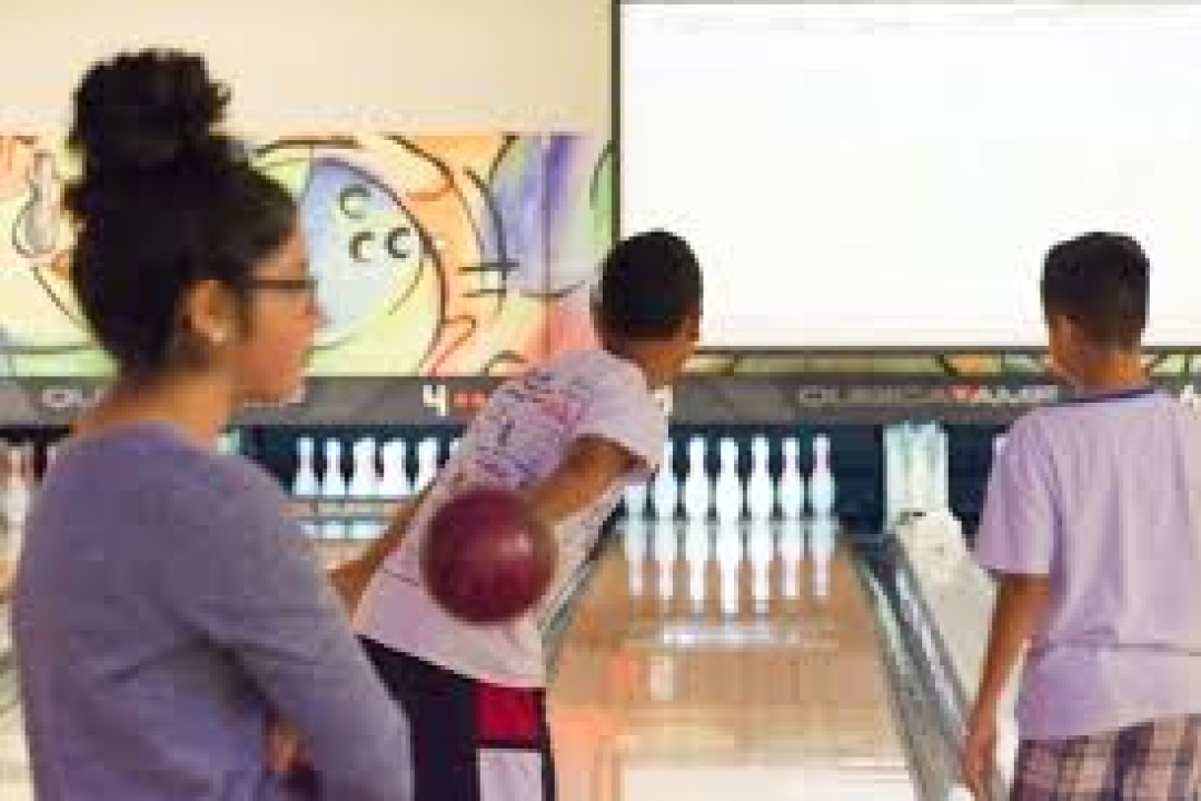 Teenagers enjoying bowling
