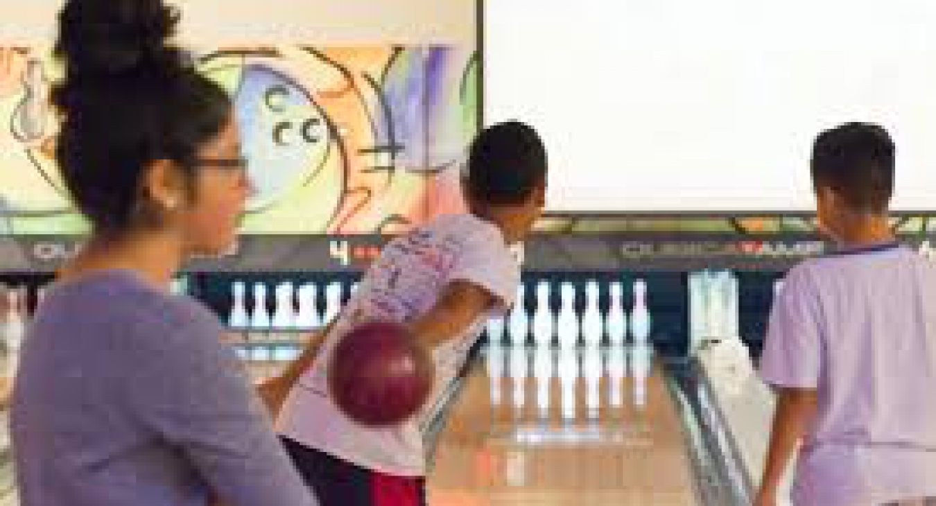 Teenagers enjoying bowling