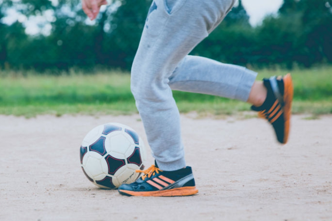 Child kicking a soccer ball