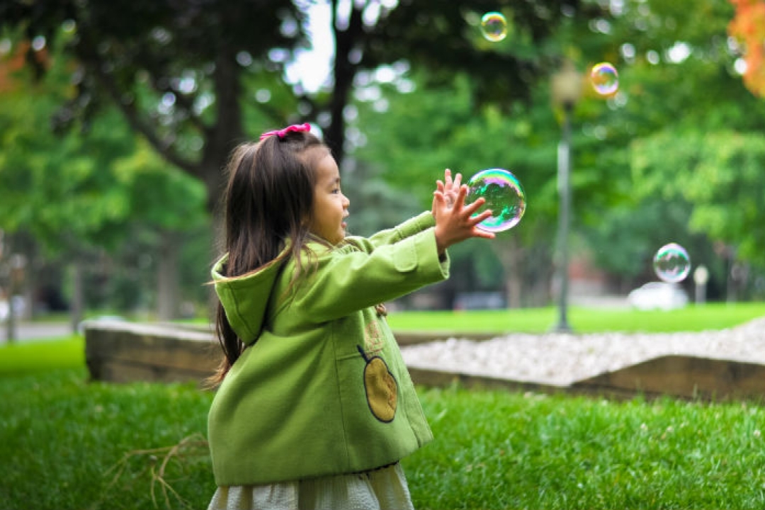 Girl playing with bubbles