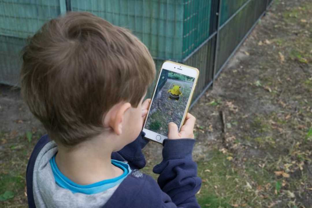 Child playing Pokémon GO