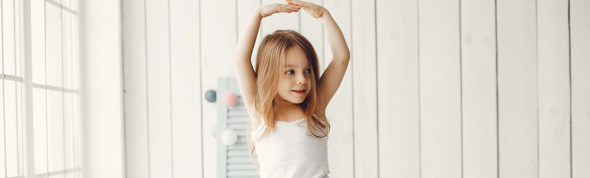Cute little girl dancing at home