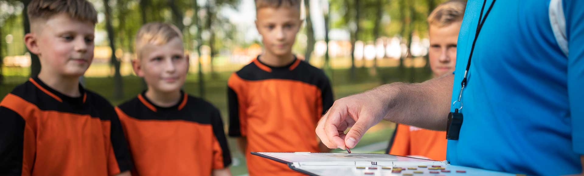 football coach showing plays to the team