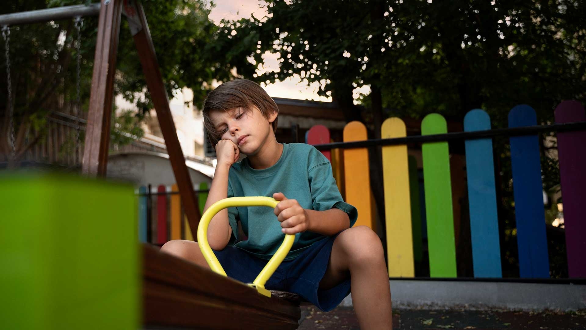 Bored Boy on Playground