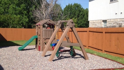 Jelly Bean rubber mulch under a backyard playset