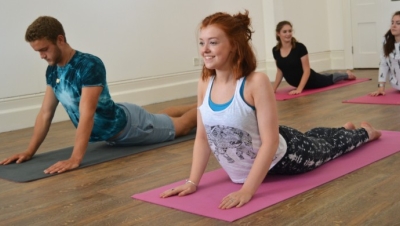 Teens in yoga poses