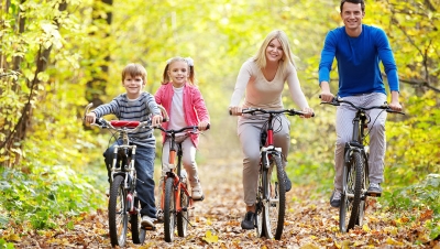happy family biking on an autumn day