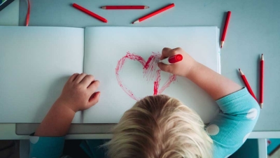 Child painting at school